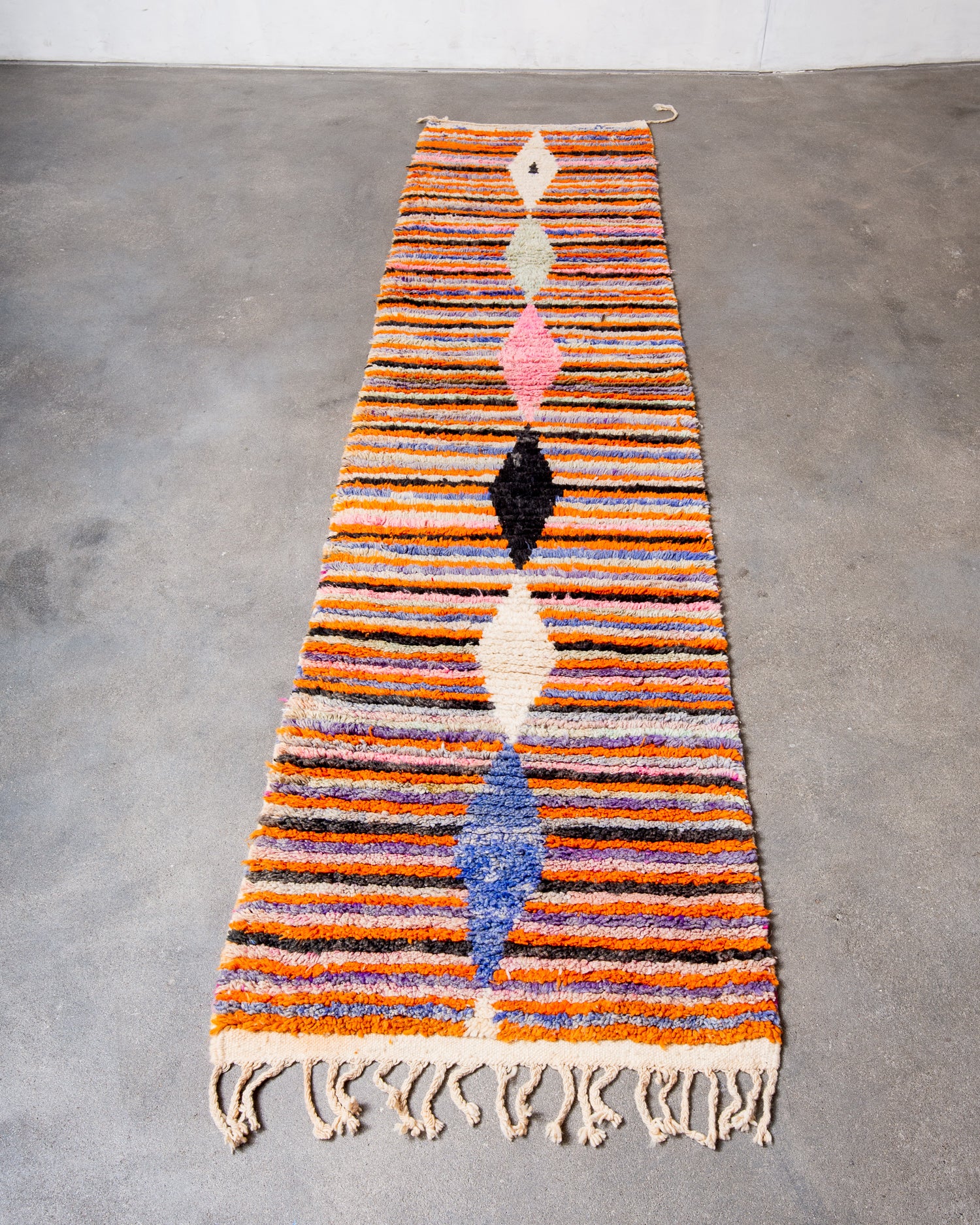 Modern, designer, handcrafted Berber runner rug from Morocco. Vintage carpet with beautiful colours and patterns and fluffy texture.